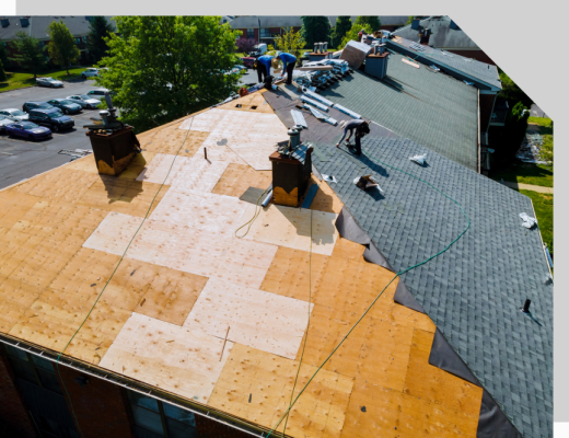 roofers working on top of a building